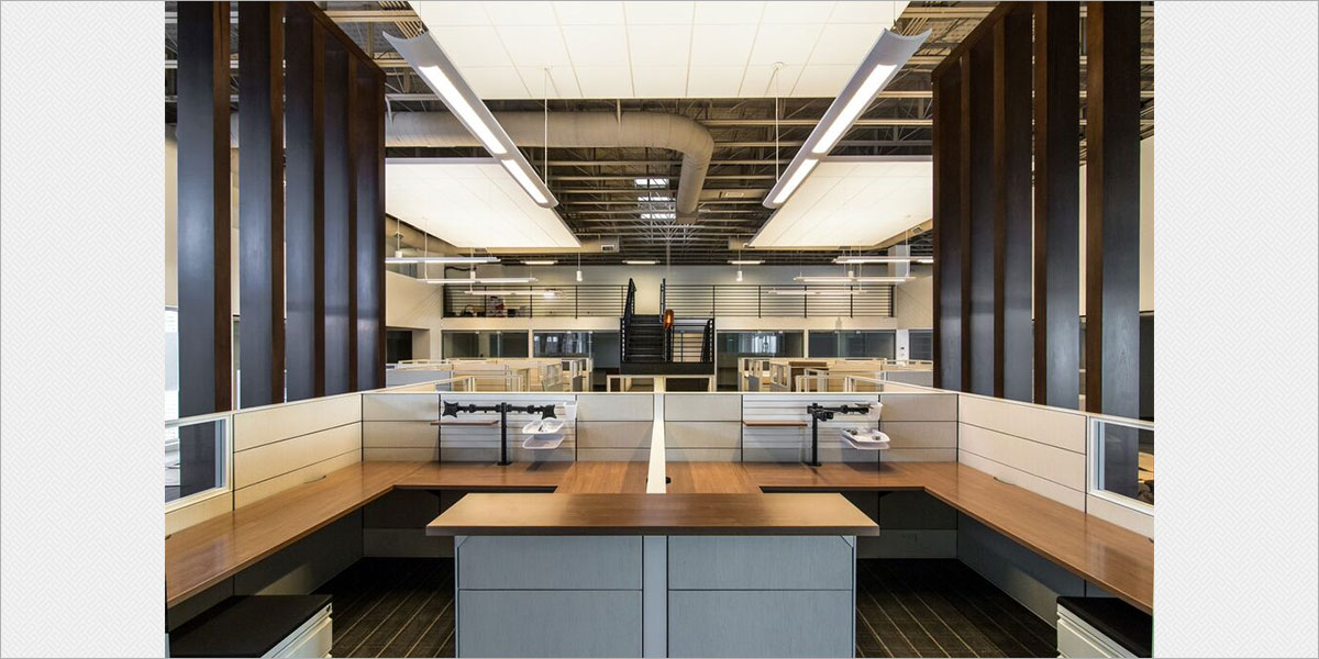  Focal Point Verve IV fluorescent direct / indirect pendants illuminate the suspended acoustic ceiling clouds.